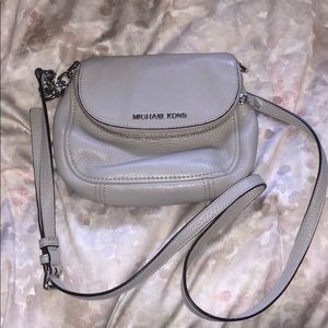 Gray Michael Kors cross body bag.